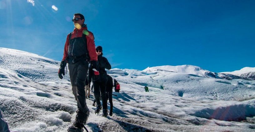 People trekking over the Perito Moreno Glacier.